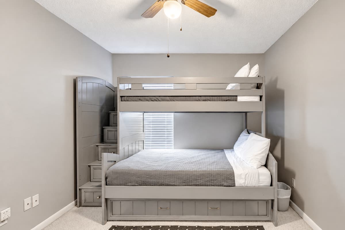 Step into the playful charm of Bedroom 4, where a delightful cozy bunk bed steals the spotlight.