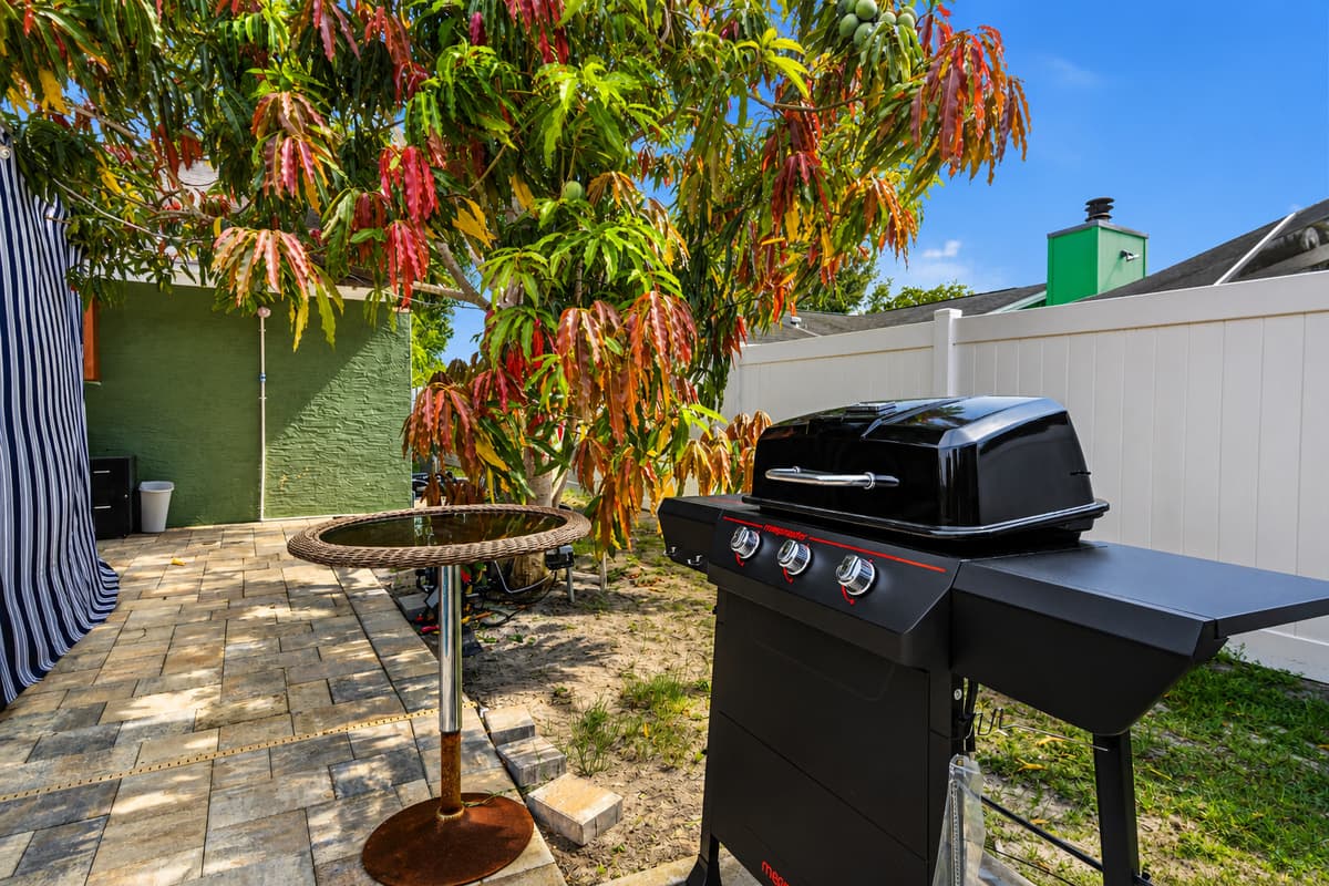Fire up the grill and enjoy outdoor cooking in the spacious backyard setting.