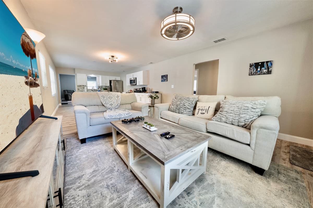 The centerpiece of this inviting space is our plush cream-colored couch, beckoning you to sink in and relax.