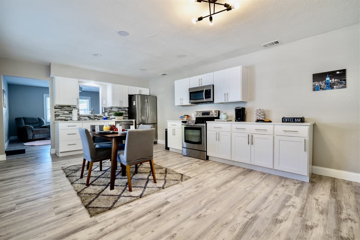 The dining area's proximity to the kitchen ensures that culinary delights are easily shared and savored.