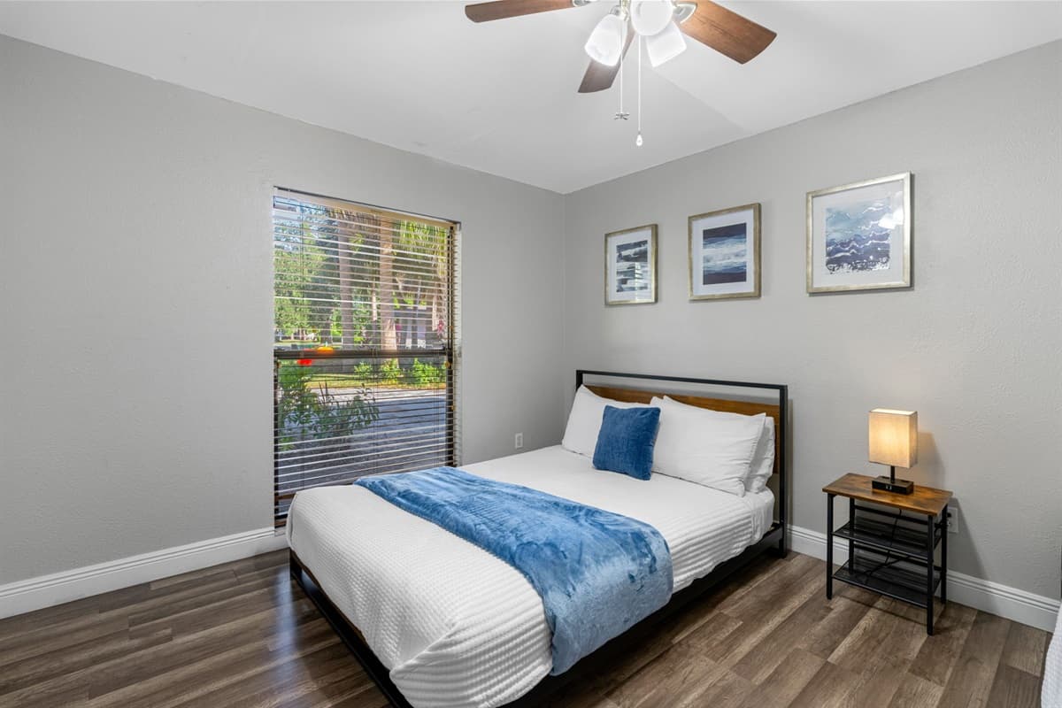 A warm, inviting room with a queen bed and bunks to accommodate the whole crew.