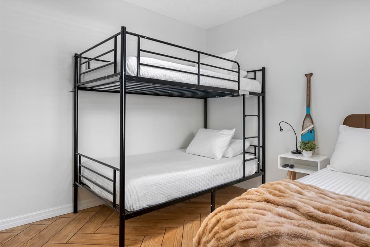 Whether you’re traveling with little ones or just need extra beds, this guest room offers flexible sleeping with a full-size bed and sturdy bunk beds.