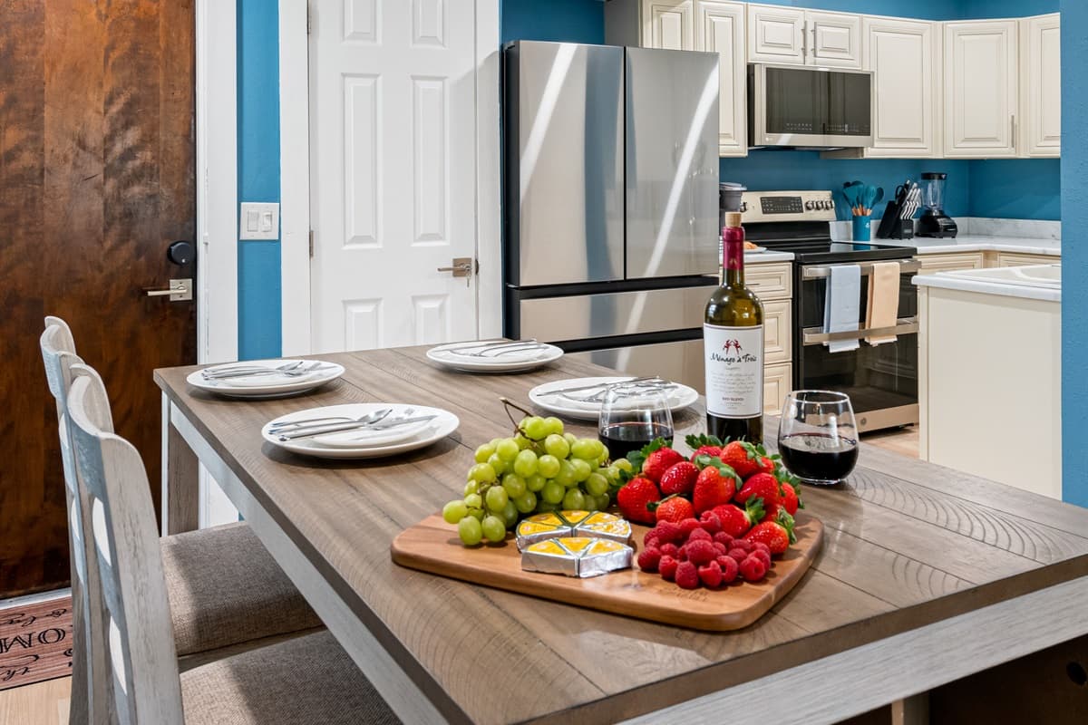 The dining area seamlessly blends with the surrounding kitchen, allowing for easy and convenient access to culinary delights.