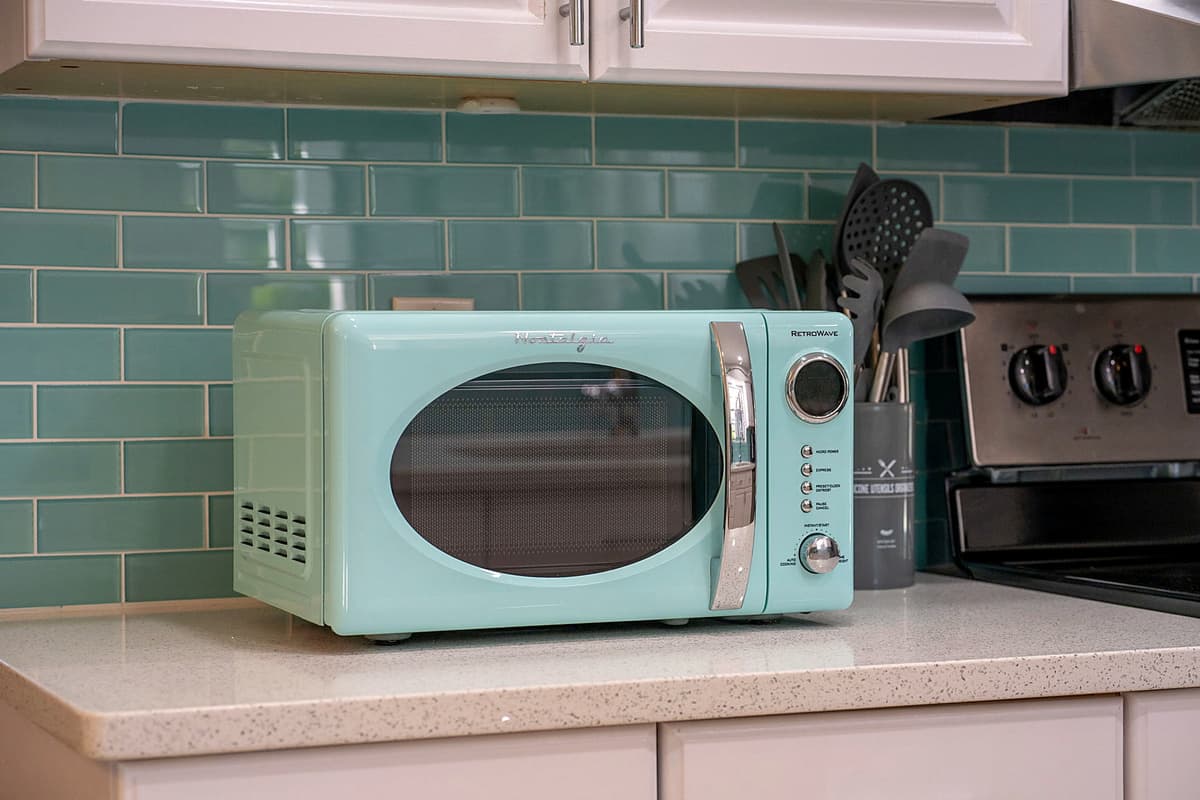 A microwave is conveniently placed for quick heating, making snack and meal prep a breeze.