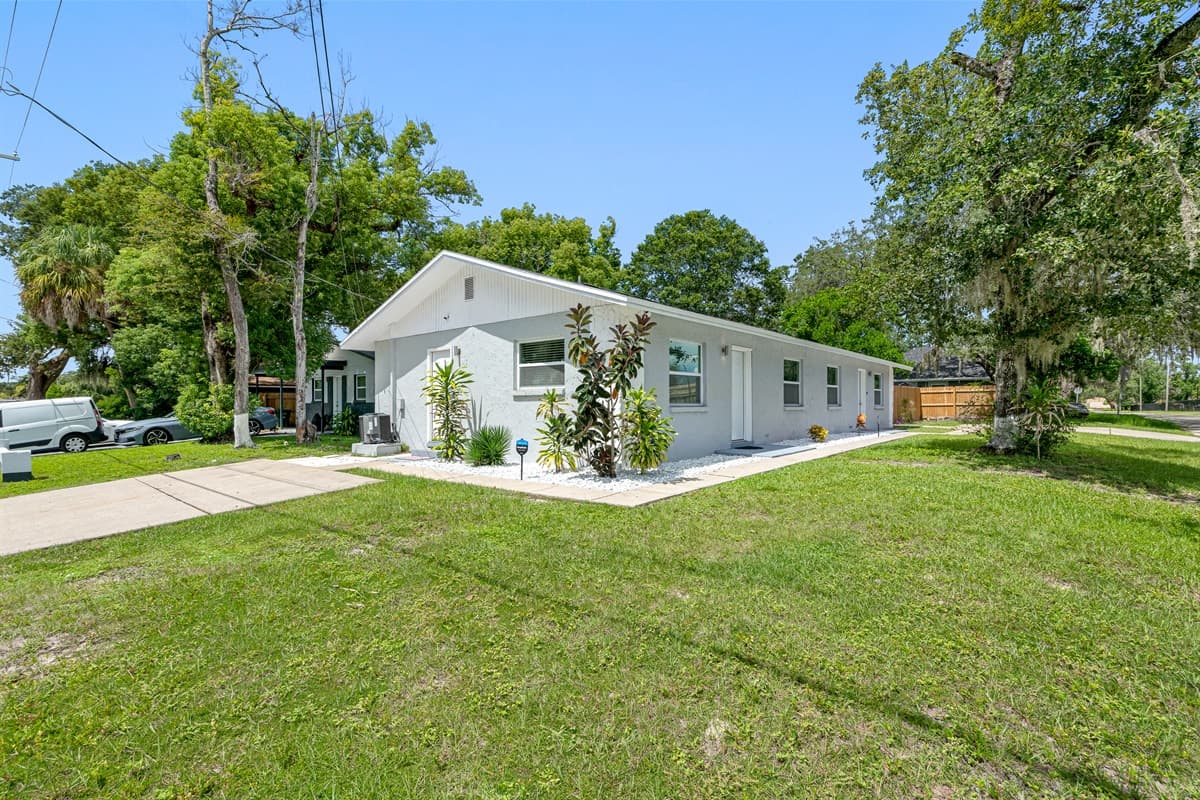 Stunning front view of the house showcasing the front yard and parking area that is equipped with CCTV cameras to ensure your safety during your stay. If you are interested in this property, send us an inquiry now!