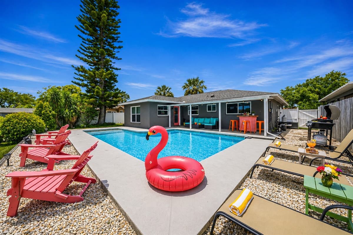Poolside lounge chairs create a fun, resort-style vibe.