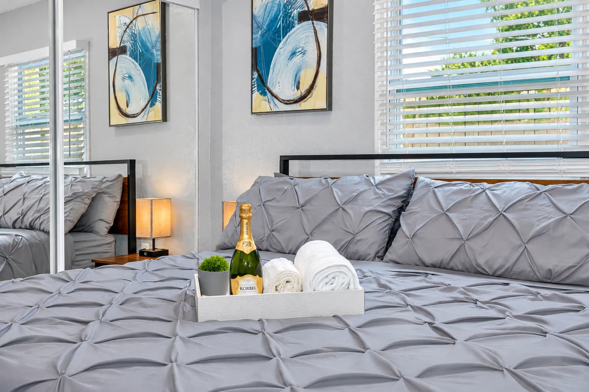 A king bed made for slow mornings. Soft pillows, crisp bedding, and a little welcome tray. Sleep in, then roll out to the pool. Nobody needs an alarm on vacation.
