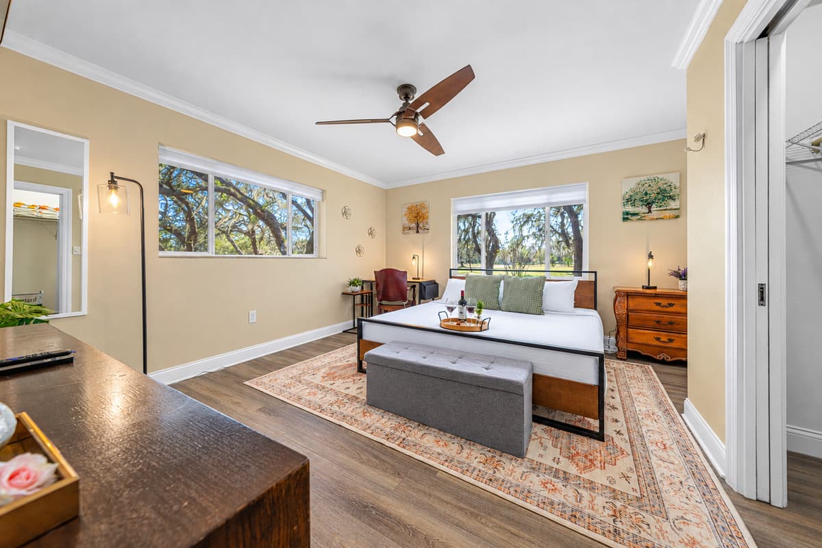 Unwind in this spacious king bedroom, thoughtfully styled with cozy textures, natural light, and a peaceful atmosphere.