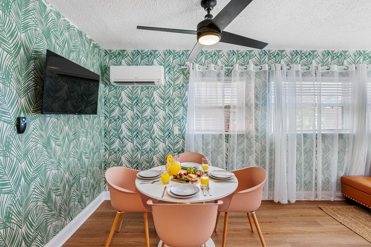 Featuring a stylish 4-seater round dining table that beckons you to indulge in coastal-inspired feasts.