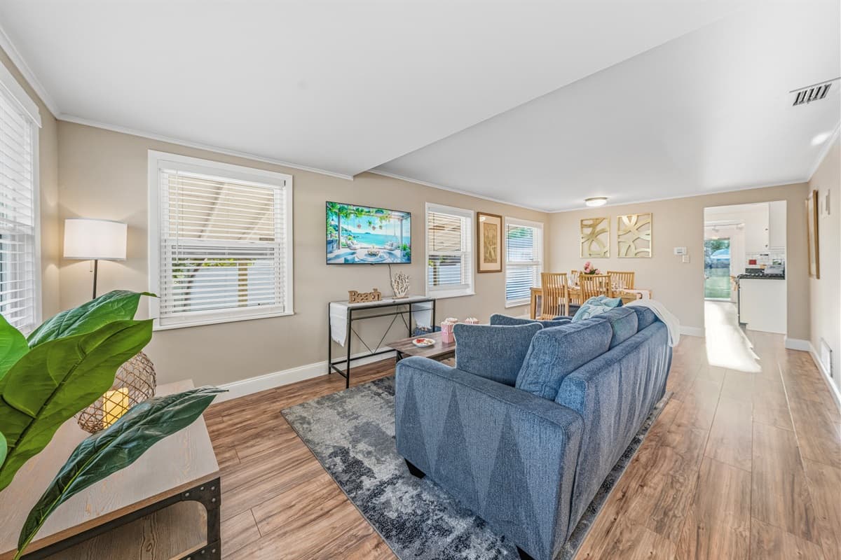 Spacious open-concept layout connecting the living, dining, and kitchen areas.