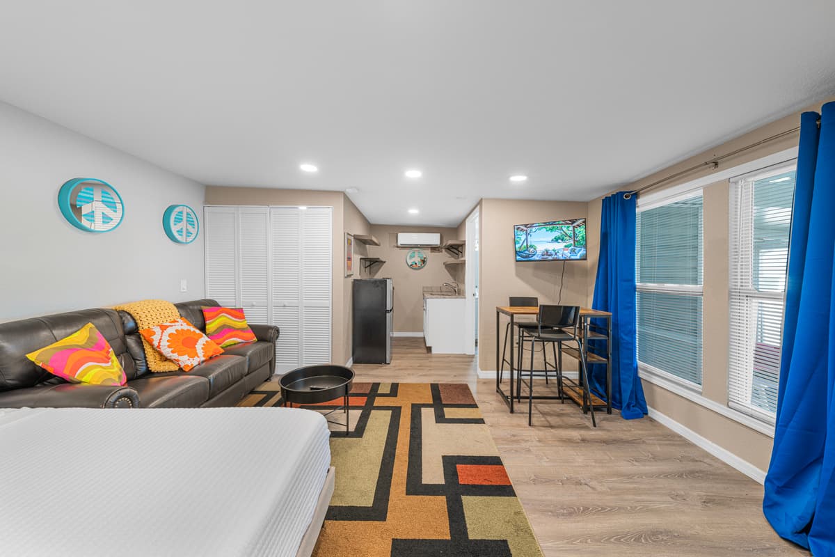 Bright and inviting living room with plush sectional seating, stylish décor, and plenty of space to relax. — photo 52