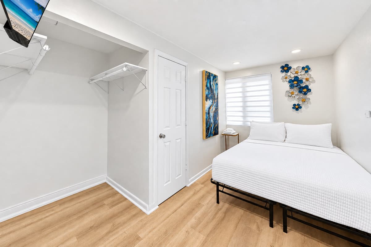 Private detached studio suite featuring a queen bed, modern furnishings, and additional privacy away from the main house.