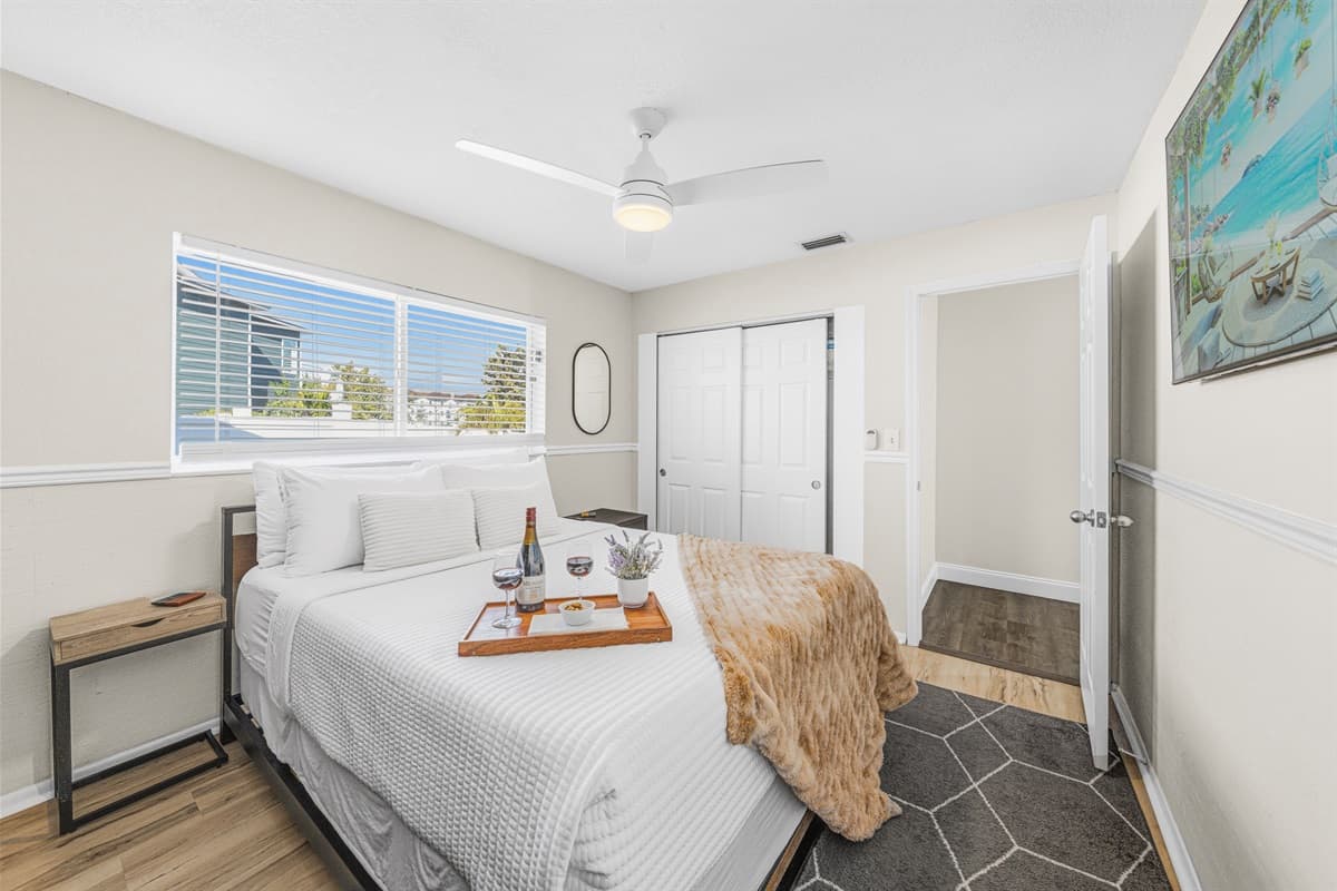 Bright and inviting queen bedroom designed for a restful night's sleep.