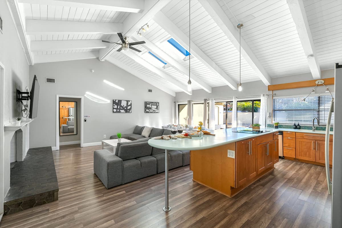 This open-concept kitchen features ample counter space and storage — ideal for families or groups.