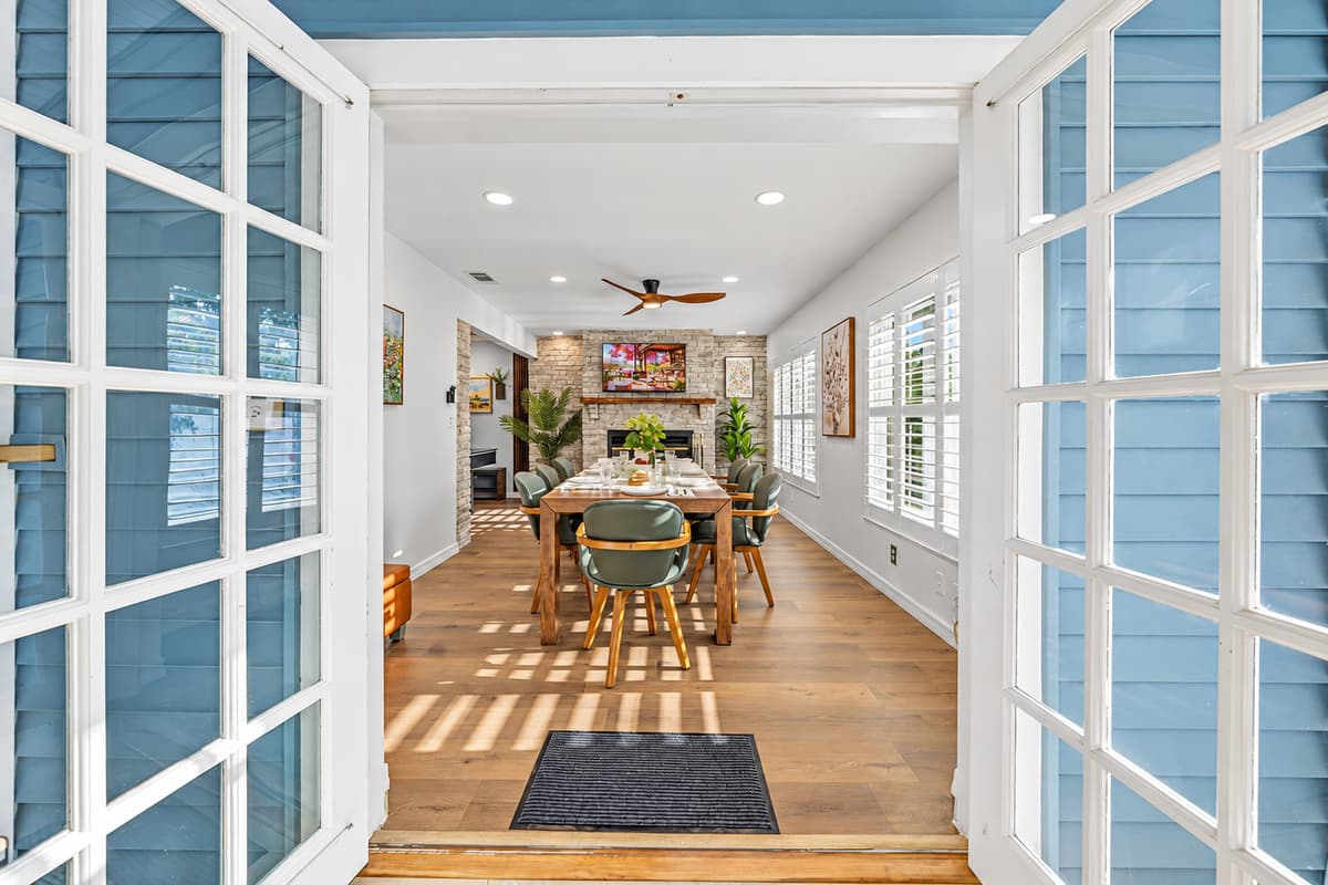 Welcoming entryway with French doors leading into the dining and living areas—bright and inviting 