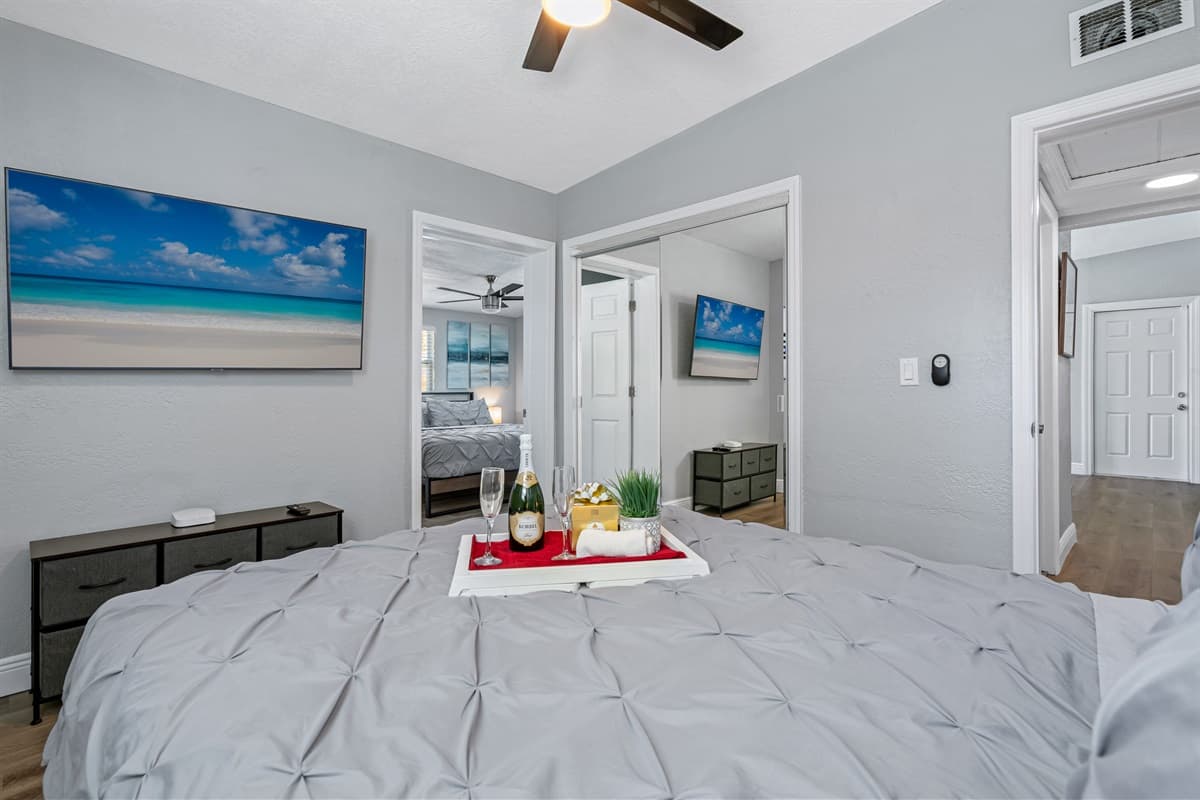 The room also boasts a ceiling fan, which gently circulates the air and creates a cool and comfortable environment.