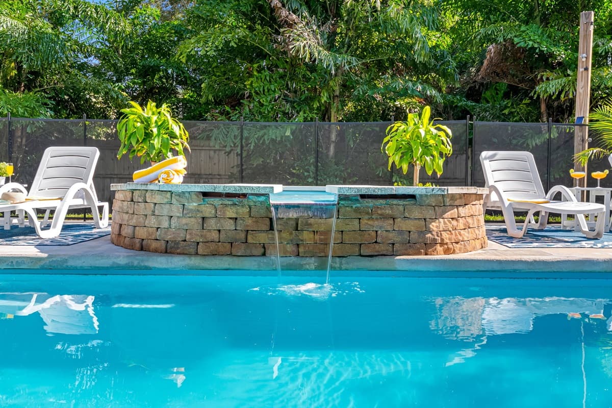 Enjoy the ultimate getaway in this inviting backyard with a crystal-clear pool, perfect for lazy afternoons or family fun in the sun.