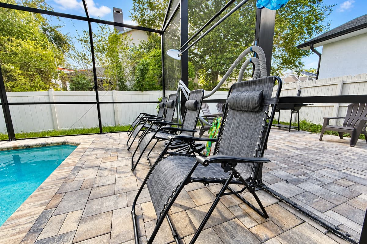 Stretch out and soak up the sun on multiple reclining loungers or gather around the shaded seating area for poolside conversations, card games, or reading a good book.