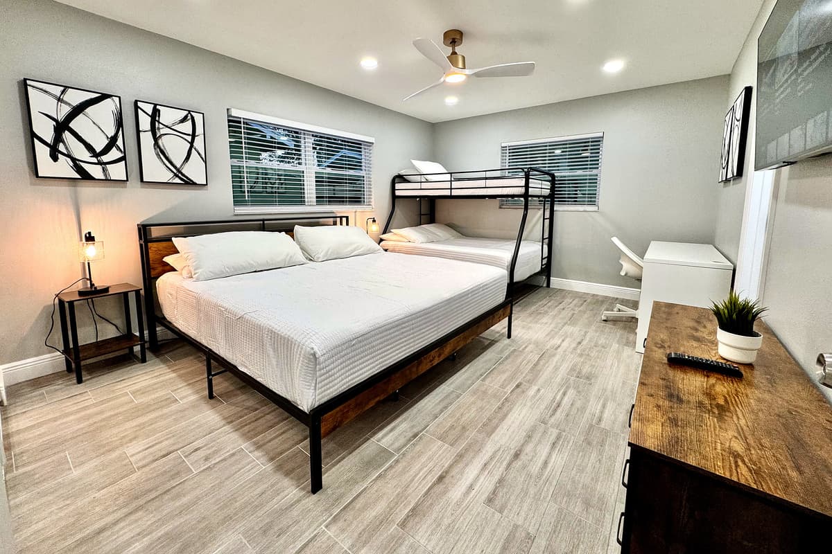 This bedroom is both functional and inviting, designed to accommodate the diverse needs of your group while maintaining the comfort and quality you expect.
