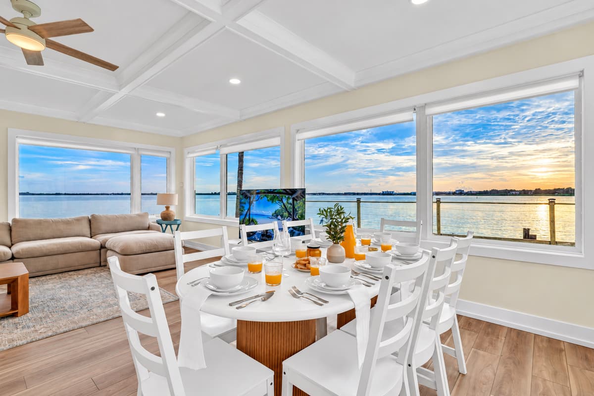 Breakfast as the sun comes up. The table is set and the sky is glowing over the bay. Every meal here comes with a view.