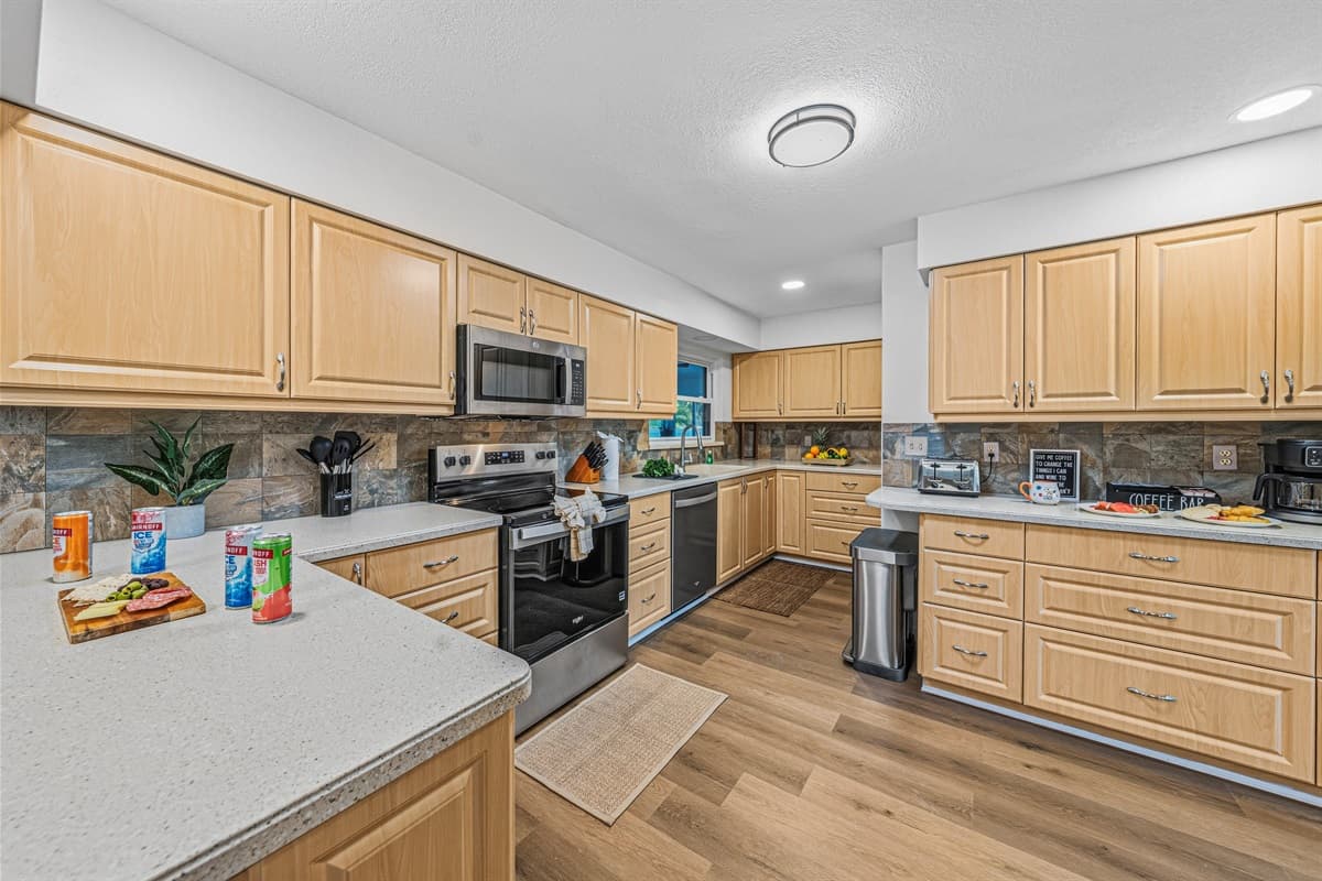 Fully equipped kitchen with modern appliances and an open layout for easy meal preparation 