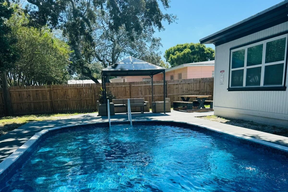 This is our amazing pool with a patio perfect for relaxation with family and friends on hot days in Florida. Our pool is heated perfect for evening dips or swims during cold days. Book this be