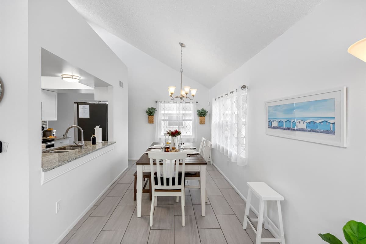 Sunlight streams through the windows, creating a cheerful dining area where every meal feels special.