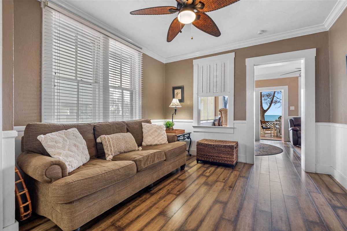 The cozy atmosphere of the living room is further enhanced by its tasteful decor, which blends modern and classic elements to create a sophisticated yet inviting ambiance.