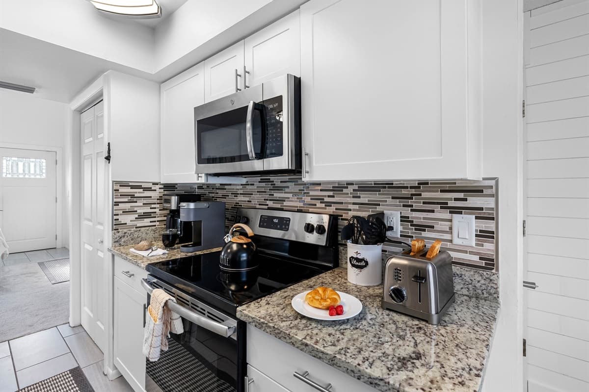Cook like a pro in this modern kitchen with plenty of counter space, quality cookware, and everything you need for home-cooked favorites.