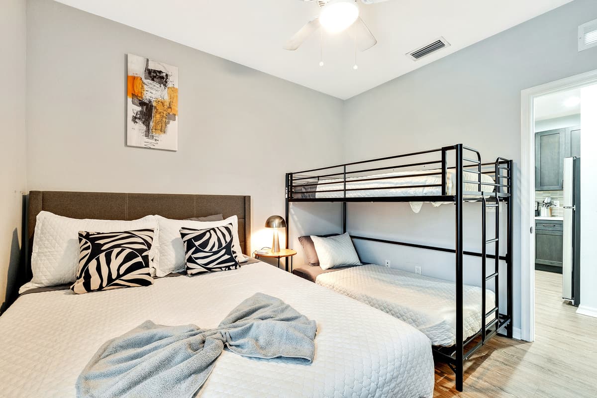 Adding a touch of versatility and whimsy, this Bedroom features a charming bunk bed, offering not only additional sleeping space but also a playful element to the room's ambiance.