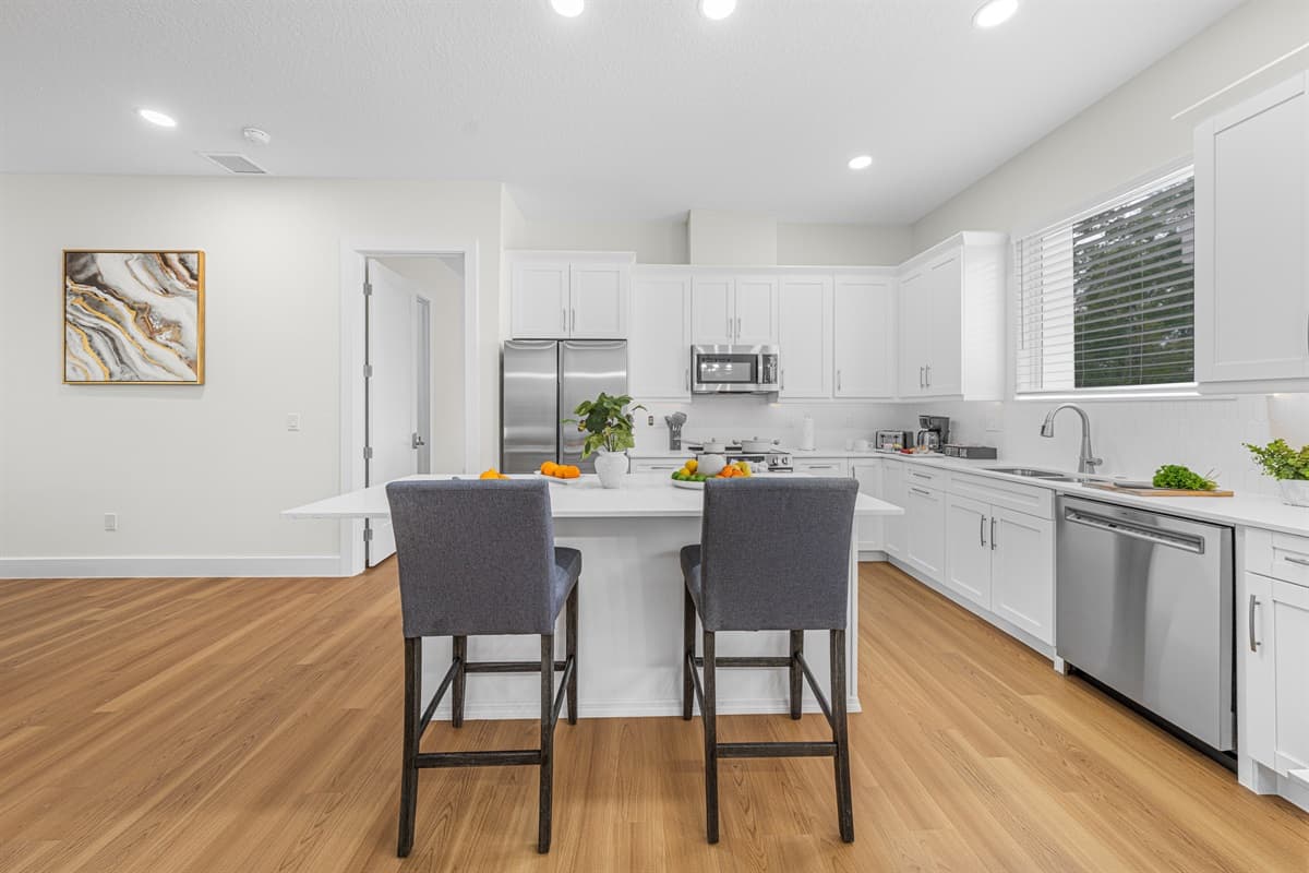 Kitchen with bar seating and open design—ideal for casual meals and socializing.