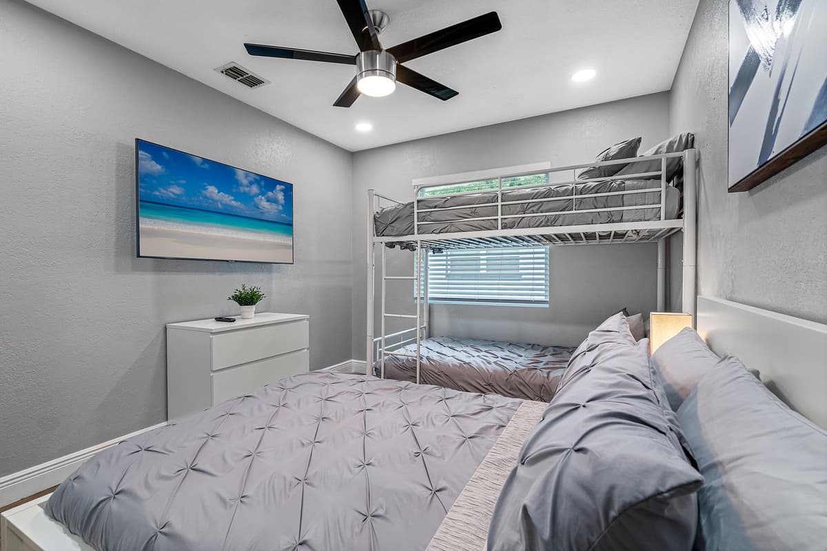 This impeccable room is great for kids who loves sleepovers or for small families who has small kids. It has a twin sized bed, bunkbed, drawers for storage and its own smart TV.