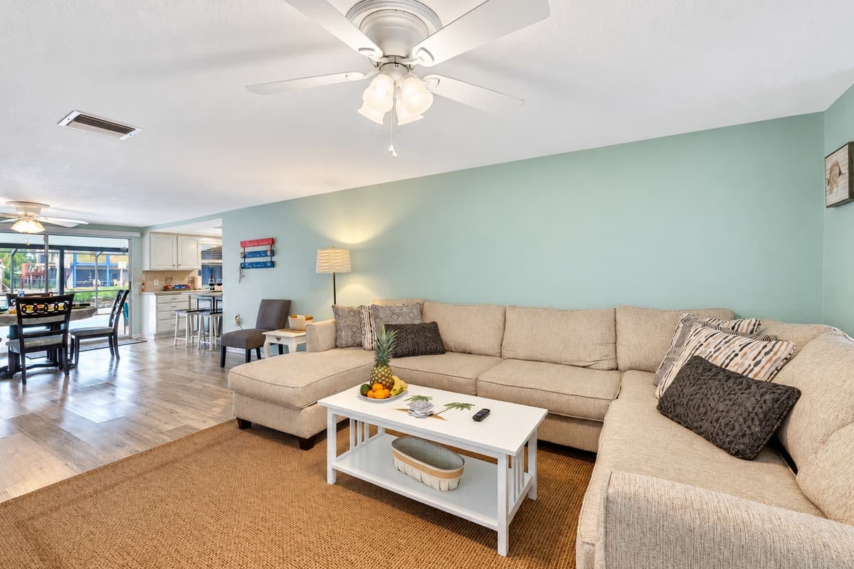 Natural light filters through strategically placed windows, accentuating the tasteful decor and creating a warm, inviting glow.