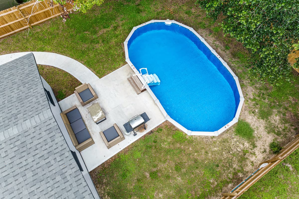 Top view of our lovely property showcasing the stunning heated pool and lounge area at the back of the property. Love what you see? Ask us questions and send us an inquiry as soon as possible!