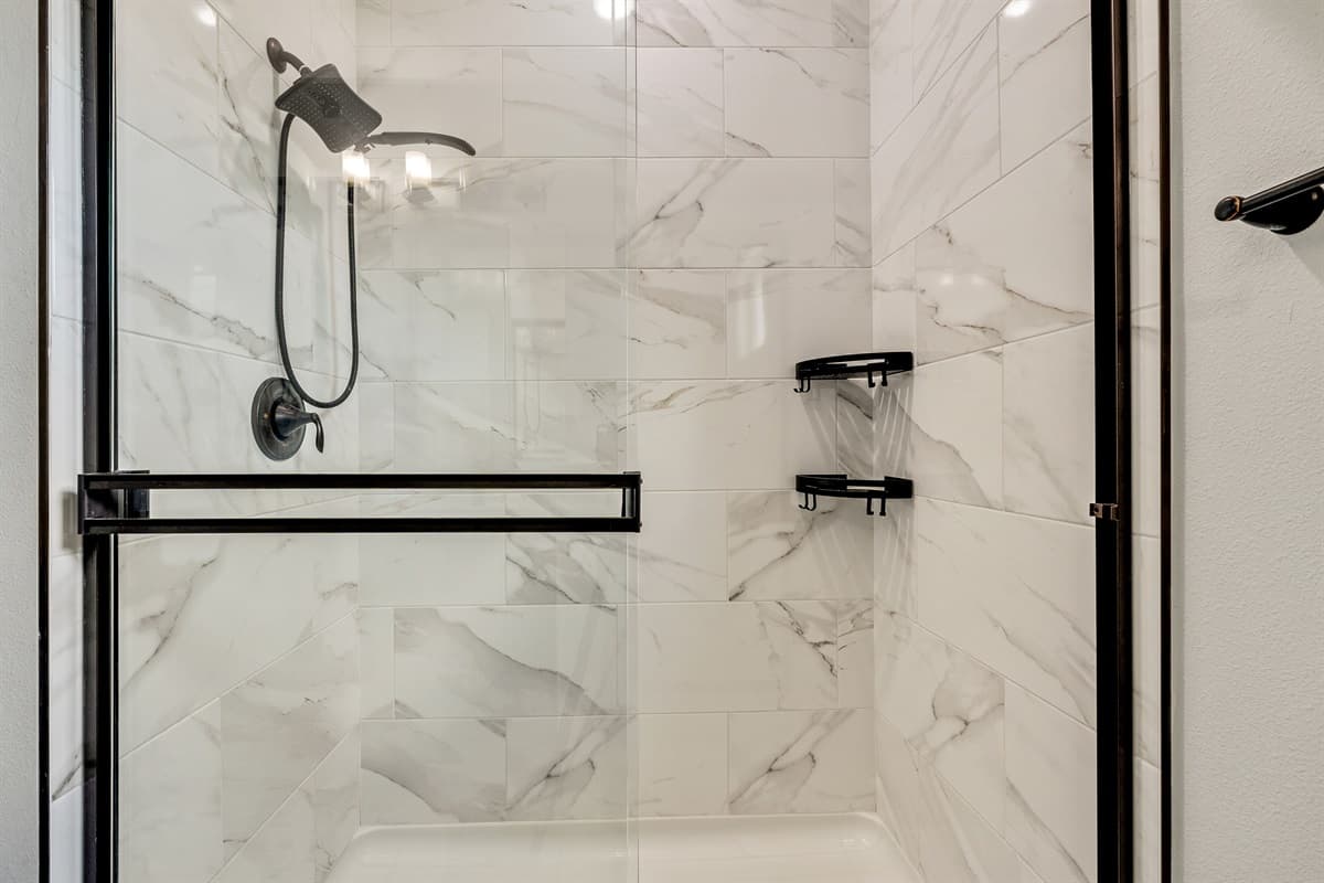 The private ensuite bathroom stands as a testament to exquisite design and seamless functionality.
