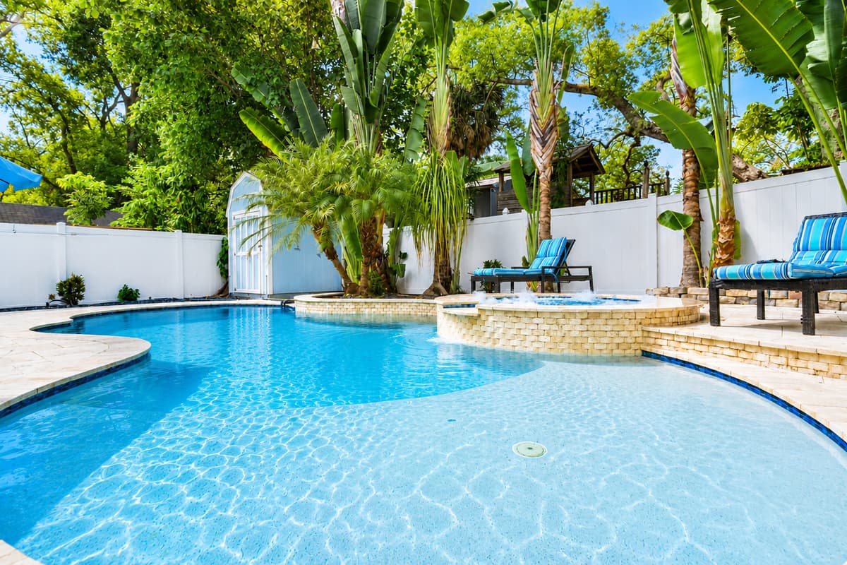 Lounge poolside and soak up the Florida sun in this beautifully landscaped outdoor space designed for relaxation.