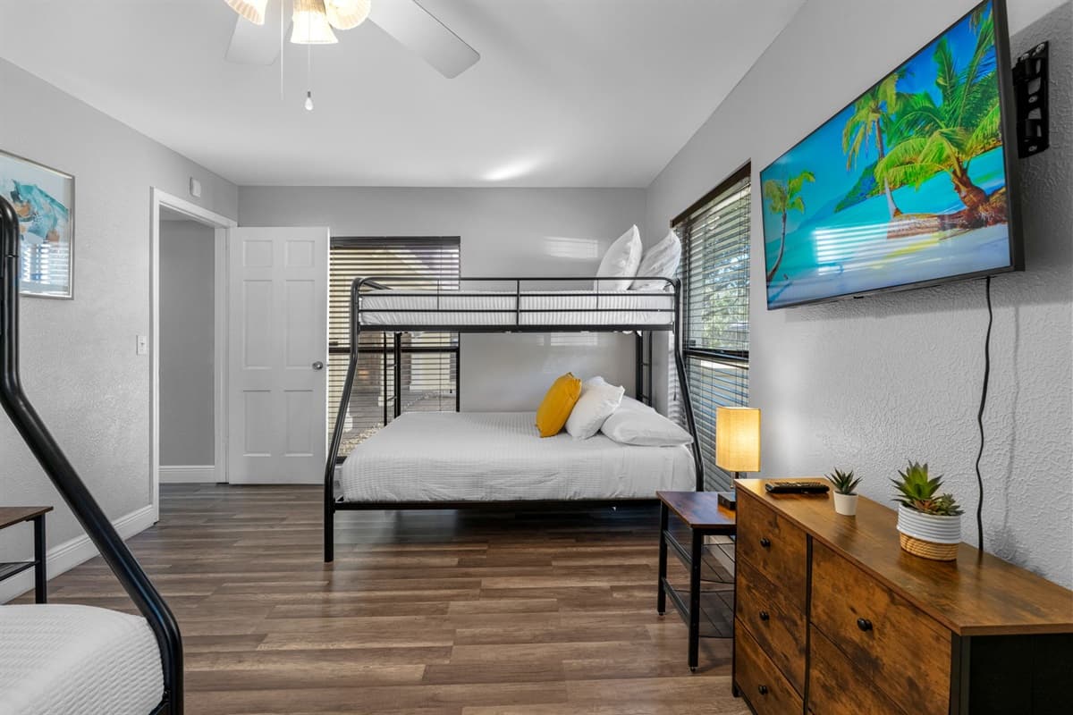 Kids and adults alike will love this cozy, spacious bunk room with a mounted TV.