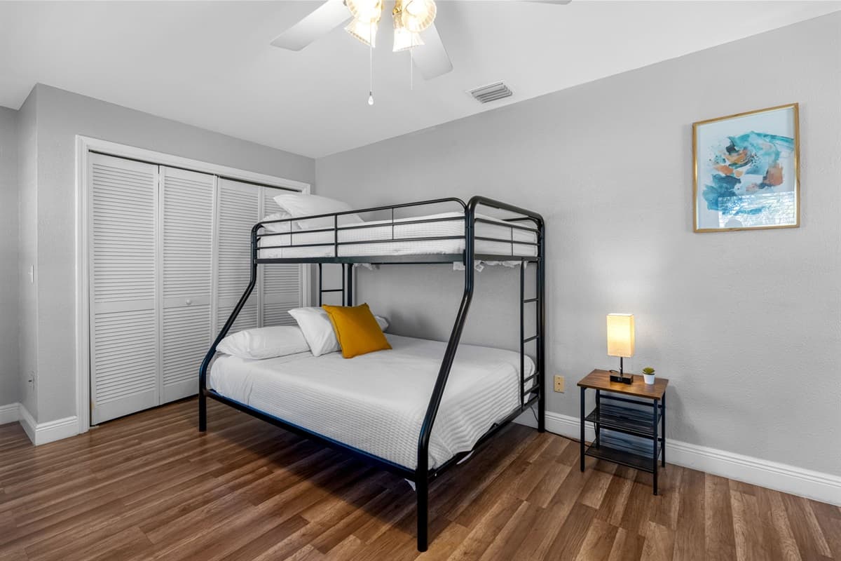 A playful yet practical setup featuring two bunk beds — ideal for large families or friend groups.