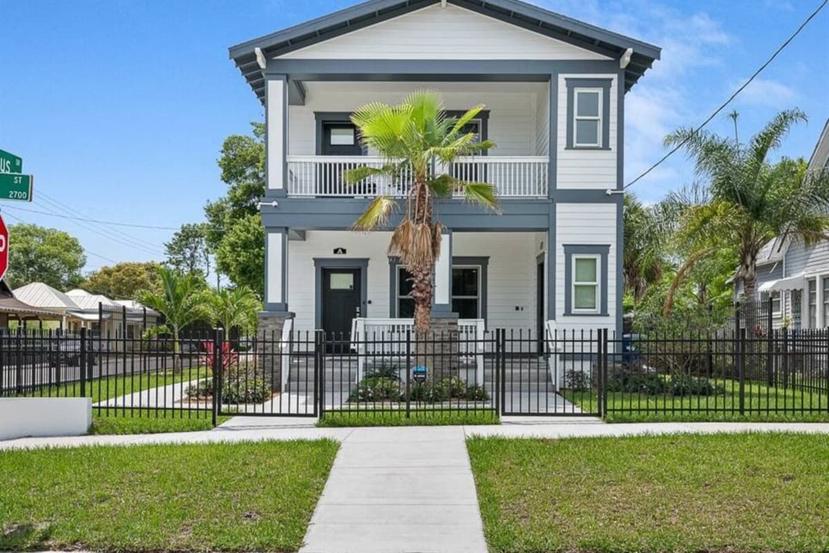 Stunning front view of the house showcasing the front yard and parking area that is equipped with CCTV cameras to ensure your safety during your stay. If you are interested in this property, send us an inquiry now!
