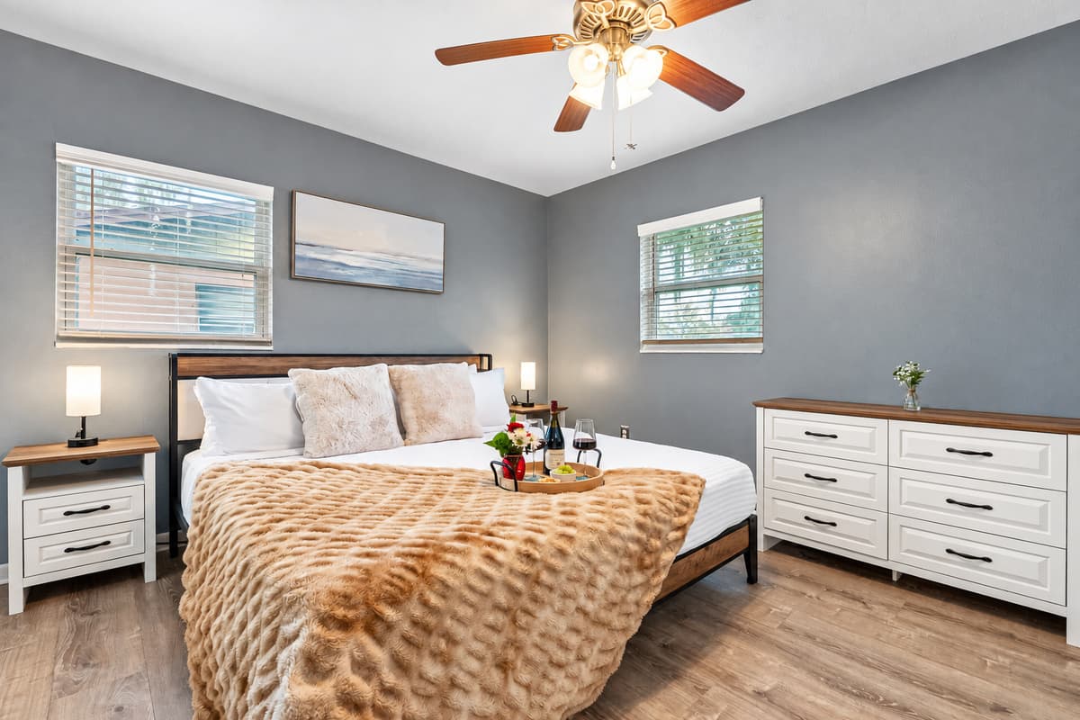 Elegant king suite featuring plush bedding and calming tones.