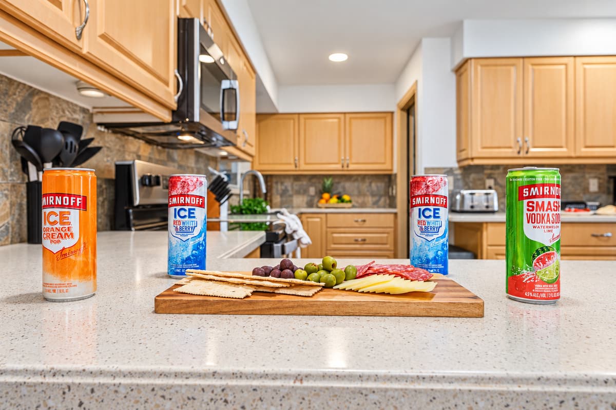 Kitchen counter styled with snacks and beverages—perfect for entertaining or casual bites 
Food and drinks shown are for staging purposes only and are not included.