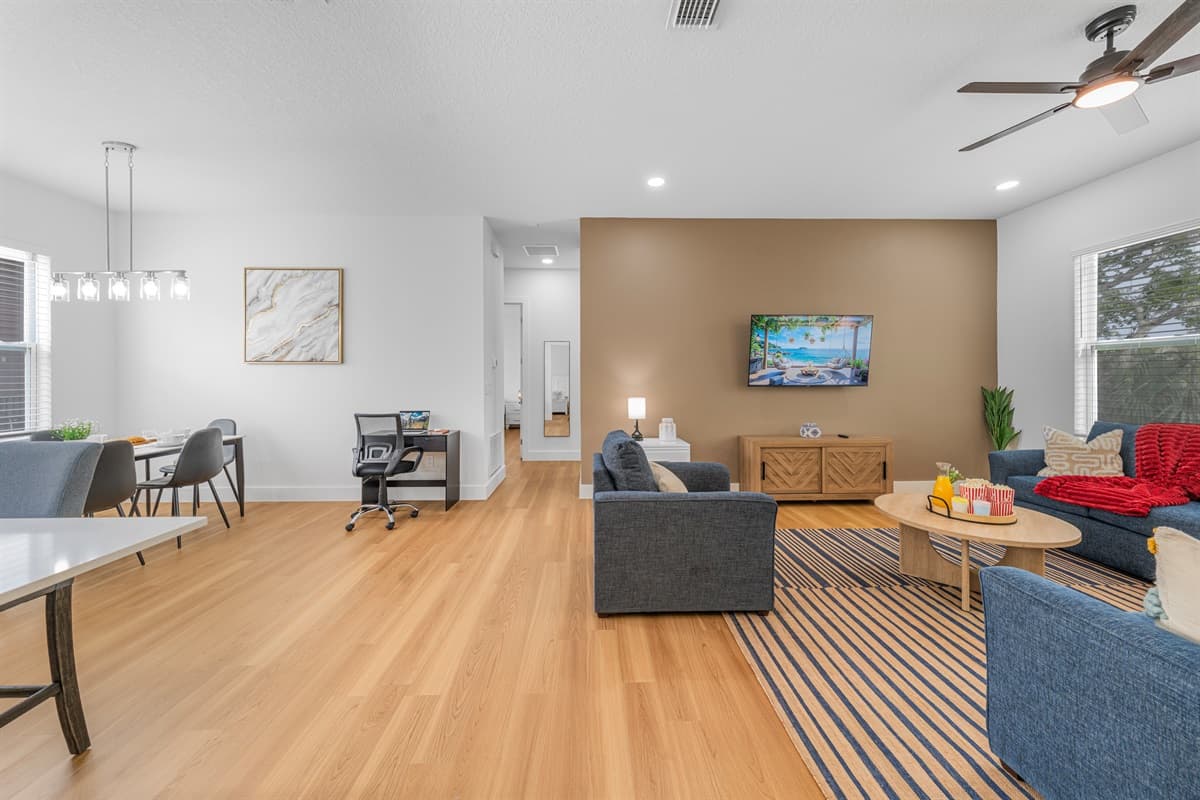 Designer touches throughout — from the striped area rug to the curated art pieces. This space feels like a boutique hotel.