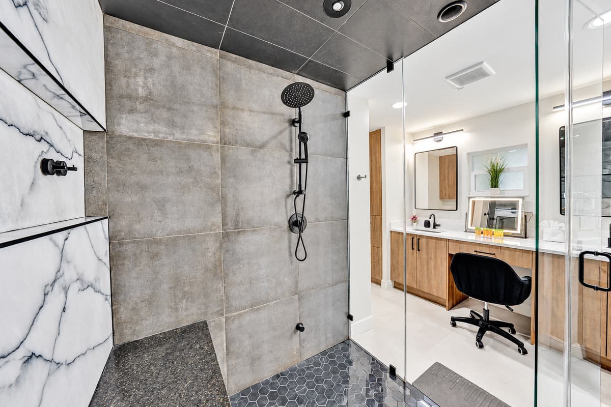 Take the call, then take the shower. Both in the same private corner.