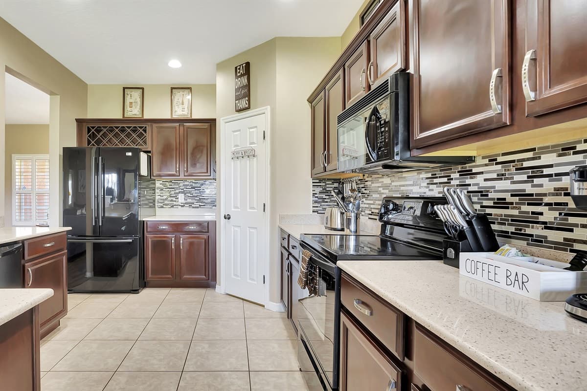 In this open-concept design, the kitchen effortlessly melds with the living room and dining area, fostering an atmosphere of togetherness and connectivity.