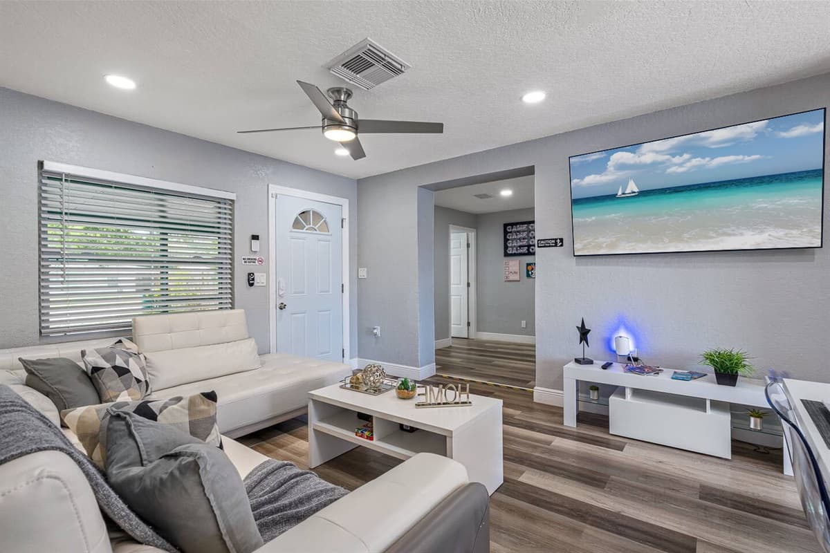 Gorgeous living room with L-Shaped comfortable couch where you could relax and enjoy watching on  our smart TV. have the best time during your stay with us! 