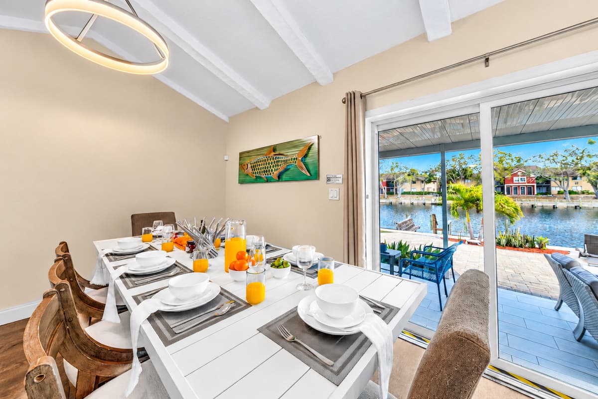 Dine with beautiful waterfront views through large sliding glass doors.
