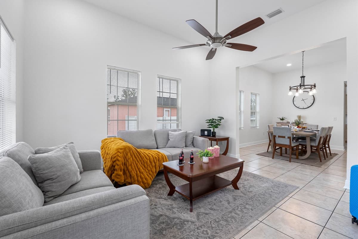 The living area provides a cozy yet spacious environment with comfortable couches, elegant décor, and a welcoming ambiance.