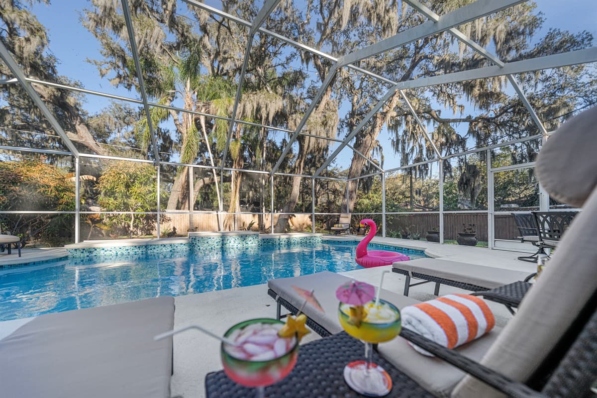 Relax poolside under the screened lanai with comfortable lounge chairs all overlooking the sparkling private pool.