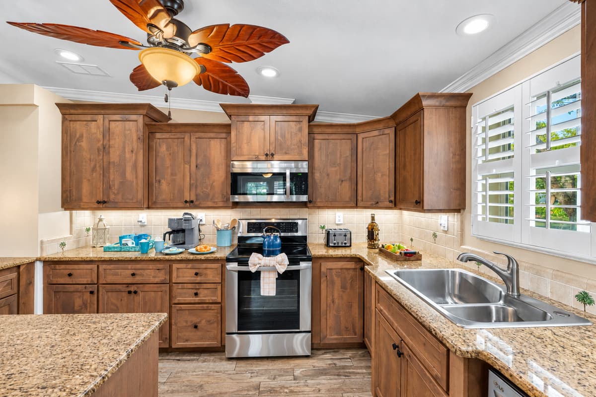 Enjoy a spacious, fully stocked kitchen complete with pendant lighting, a large island, and plenty of prep space for group meals.