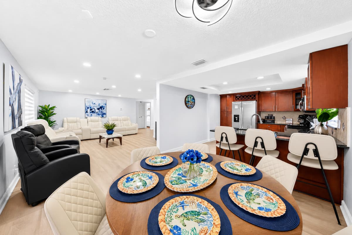 Spacious open floor plan connecting the dining room, kitchen, and living area, perfect for families and groups.